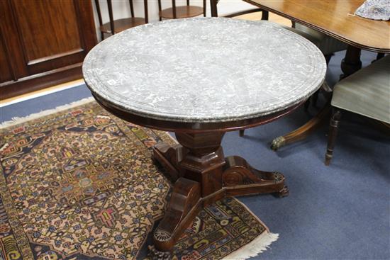 A French Empire mahogany centre table, with circular grey marble top, on hexagonal baluster stem and tripod base with lions paw feet, D